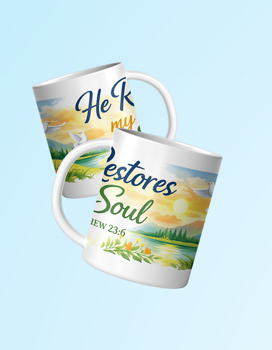 Two mugs with scenic designs and motivational text on a light blue background